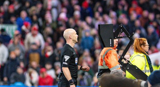 The City Ground, Nottingham, UK. 25th Nov, 2023. Premier League Football, Nottingham Forest versus Brighton and Hove Albion; Referee Anthony Taylor checks the VAR screen before awarding a penalty to Nottingham Forest in the 76th minute