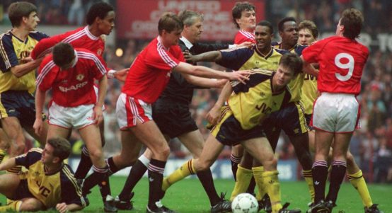 Arsenal's players at the centre of a fight with Manchester United's team. Old Trafford, Manchester, October 1990.