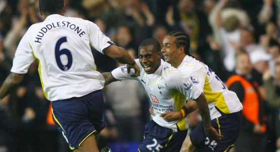Danny Rose of Tottenham Hotspur, center, celebrates with teammates Tom Huddlestone, left, and Benoit Assou-Ekotto, right, after scoring the team's first goal against Arsenal during an English Premier League soccer match at White Hart Lane, London Wednesday April 14, 2010