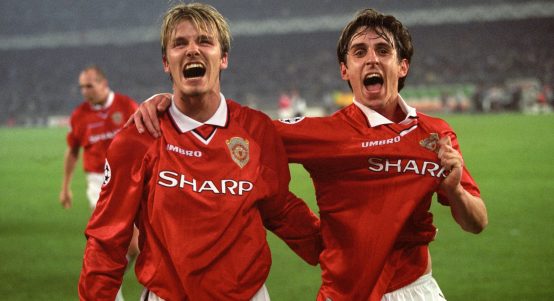 Manchester United's David Beckham and Gary Neville celebrate at the end of the UEFA Champions League semi-final victory over Juventus at Stadio Delle Alpi, Turin, Italy, April 1999.