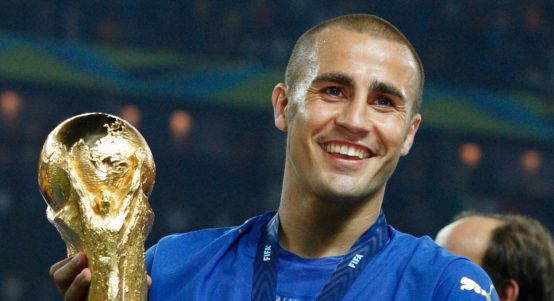 Fabio Cannavaro lifts the FIFA World Cup trophy after the 2006 final between Italy and France at Olympiastadion, Berlin, Germany, July 2006.