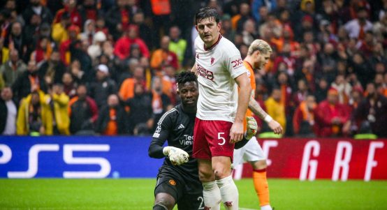 Andre Onana of Manchester United interacts with Harry Maguire of Manchester United during the Group A - UEFA Champions League 2023/24 match between Galatasaray A.S. and Manchester United at the Ali Sami Yen Arena on November 29, 2023 in Istanbul, Turkey.