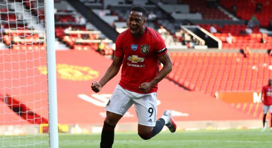 Manchester United's Anthony Martial celebrates after scoring his side's third goal during the English Premier League soccer match between Manchester United and Sheffield United at Old Trafford in Manchester, England, Wednesday, June 24, 2020.