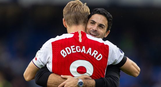 Arsenal's head coach Mikel Arteta (R) celebrates with captain Martin odegaard after an English Premier League match between Everton and Arsenal in Liverpool, Britain, on Sept. 17, 2023.