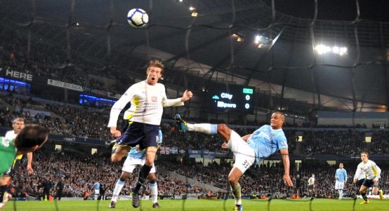 Tottenham Hotspur's Peter Crouch (left) scores the winning goal against Manchester City at Eastlands. May 2010.