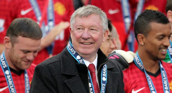 Manchester United manager Sir Alex Ferguson looks on as they celebrate winning the Premier League.