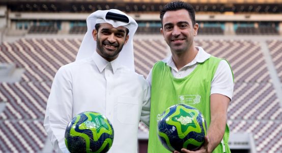 The general secretary of the World Cup's organisation committee Hassan Al-Thawadi and the World Cup ambassador Xavi Hernandez at the Khalifa International Stadium in Doha, Qatar, 4 January 2018..